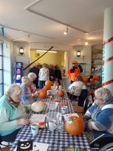 The ladies having fun carving their Pumpkins